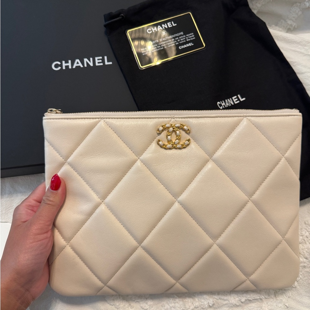 CHANEL Quilted Leather Clutch in Cream with Gold CC Logo